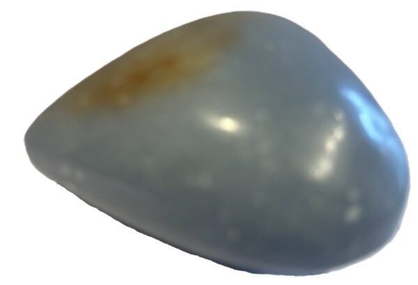Polished natural angelite carved heart crystal 2 sians emporium Smooth polished blue angelite carved heart crystal showing natural white mineral flecks on a white background